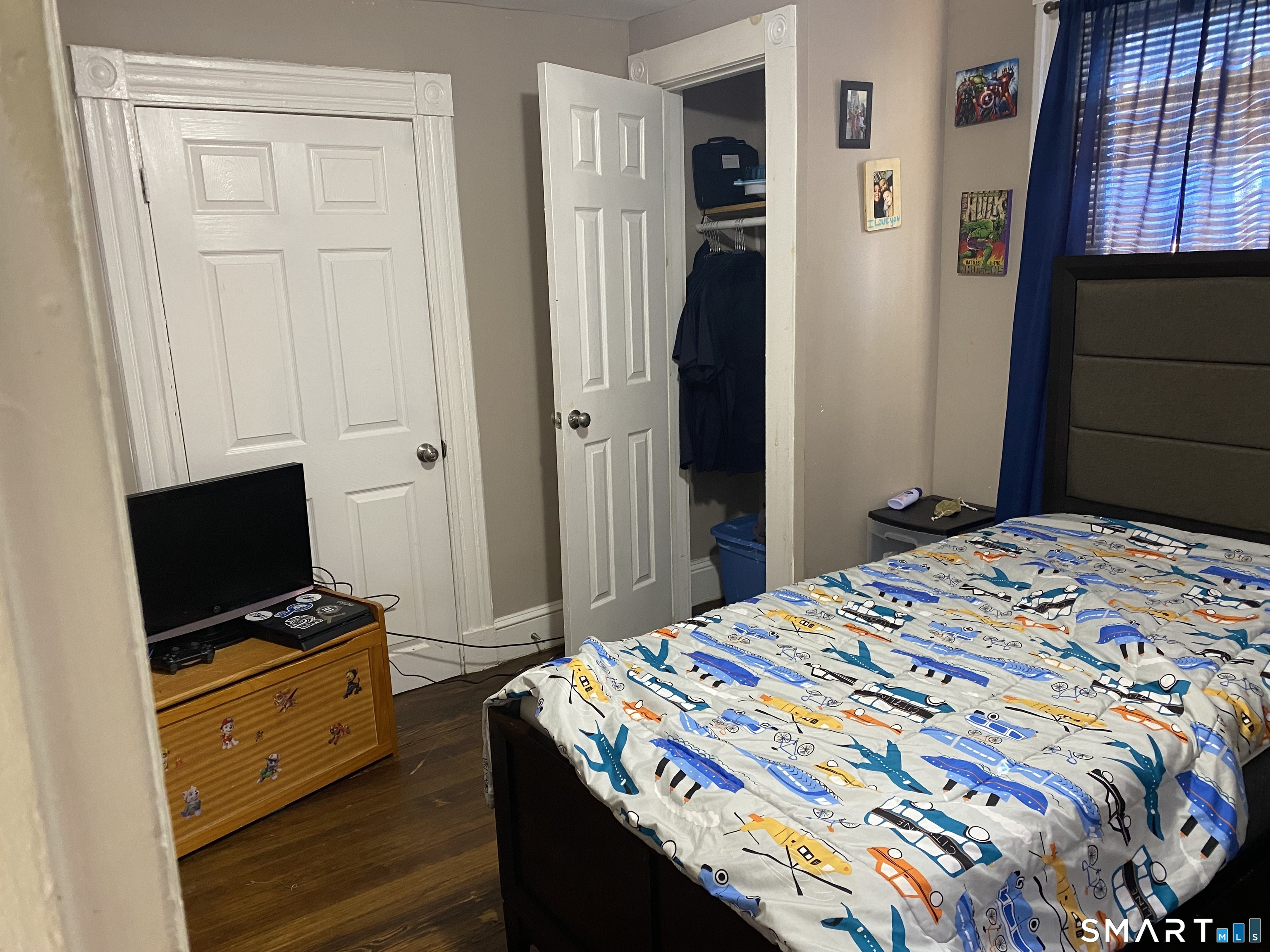 47 Wilson Avenue Windsor, CT 06095 - Photo 12 of 20 a bedroom with a bed and a tv on the dresser