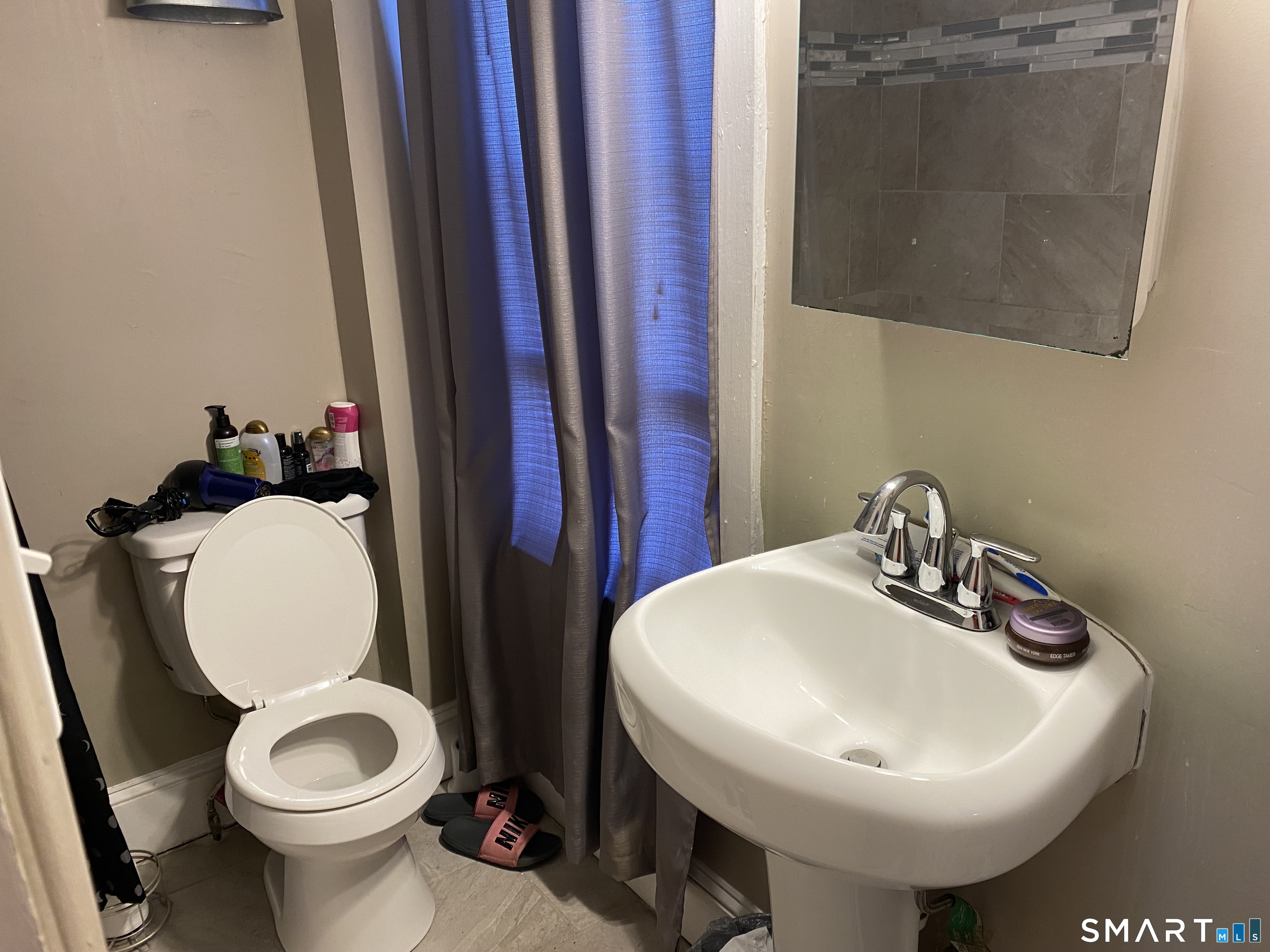 47 Wilson Avenue Windsor, CT 06095 - Photo 15 of 20 a bathroom with a toilet sink and mirror