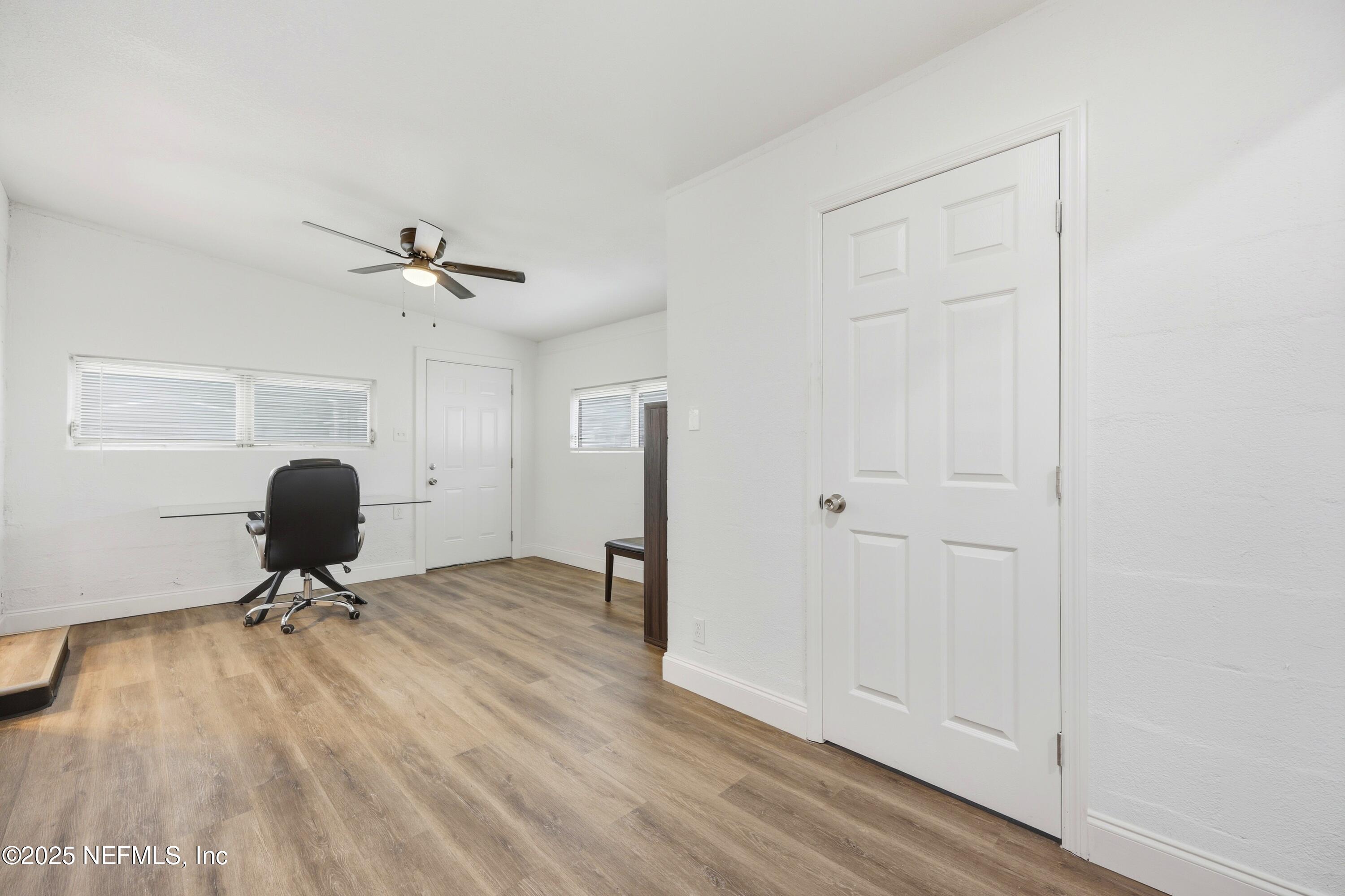 10303 Westmar Road Jacksonville, FL 32218 - Photo 11 of 14 a view of a workspace with furniture and a mirror