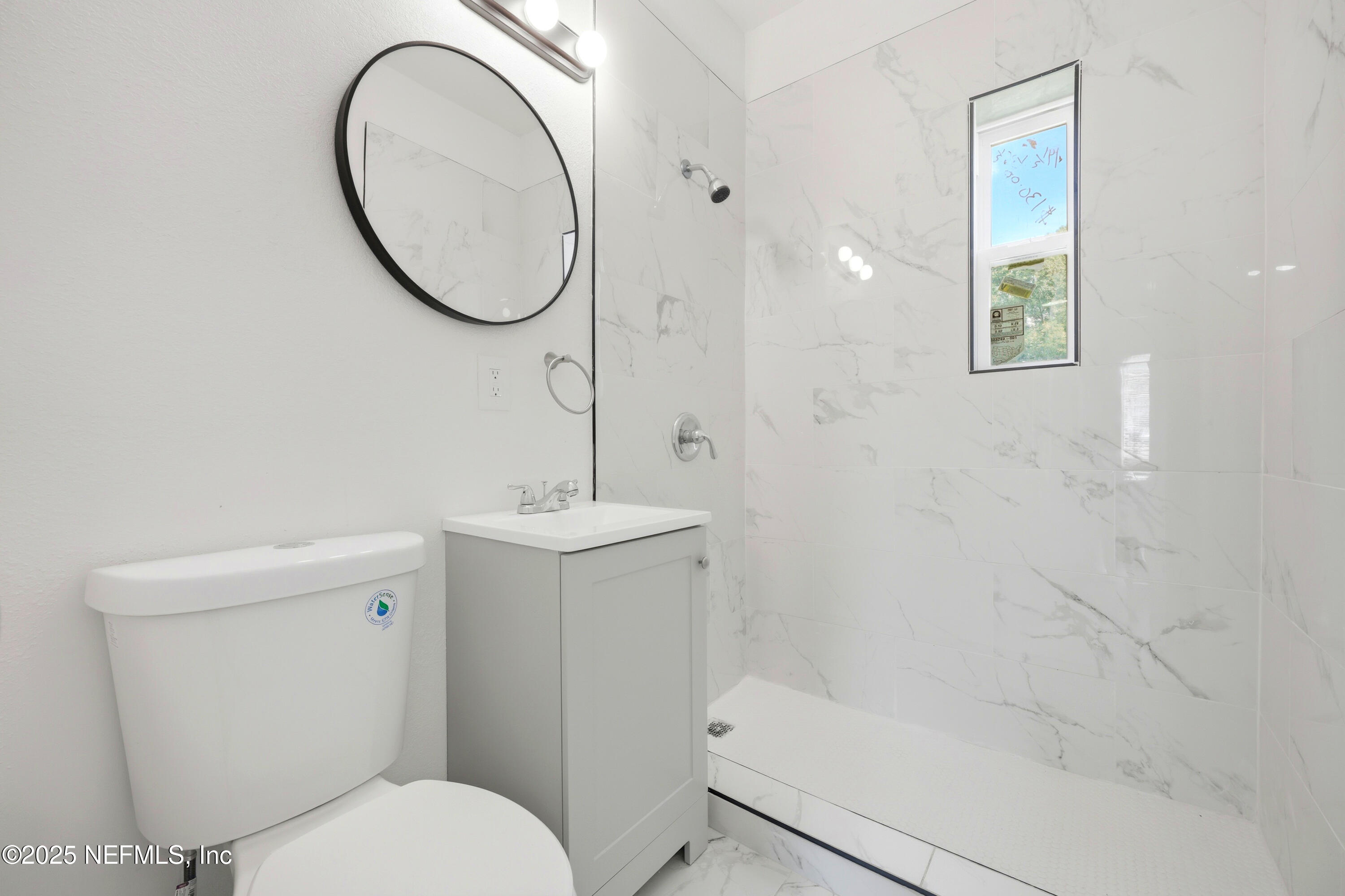 10303 Westmar Road Jacksonville, FL 32218 - Photo 12 of 14 a bathroom with a sink toilet and shower