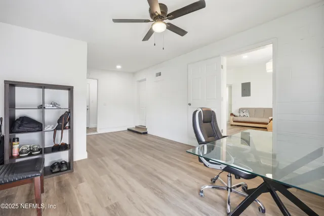 a workspace with furniture and wooden floor