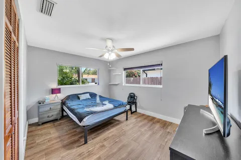 a kitchen with stainless steel appliances wooden cabinets a stove a microwave and a refrigerator