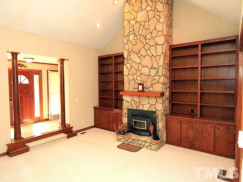 4117 Lassiter Road Wake Forest, NC 27587 - Photo 2 of 22 Relax by the fireplace in the sunken family room with soaring ceilings.