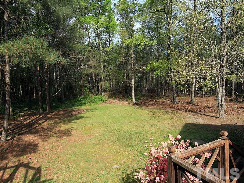 4117 Lassiter Road Wake Forest, NC 27587 - Photo 12 of 22 Private wooded back yard is partially cleared and fully fenced.
