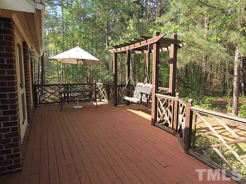 4117 Lassiter Road Wake Forest, NC 27587 - Photo 13 of 22 Relax and unwind on the built in deck swing.