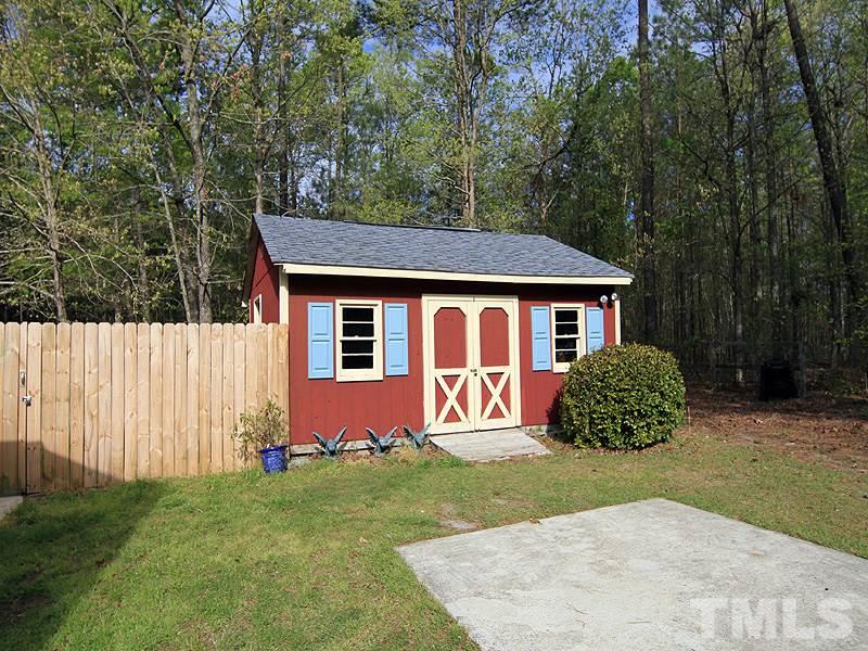 4117 Lassiter Road Wake Forest, NC 27587 - Photo 15 of 22 One of two outbuildings, this home has lots of storage.
