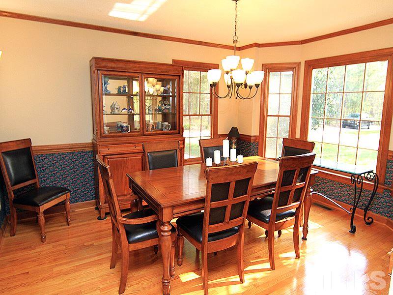 4117 Lassiter Road Wake Forest, NC 27587 - Photo 4 of 22 Entertain in the large formal dining room which flows into the kitchen.