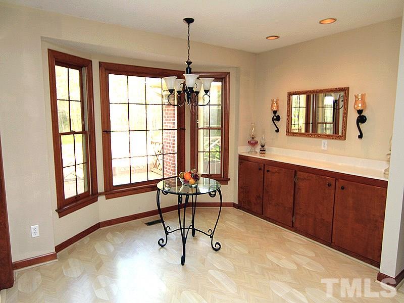 4117 Lassiter Road Wake Forest, NC 27587 - Photo 6 of 22 Open and bright breakfast area has built in buffet.
