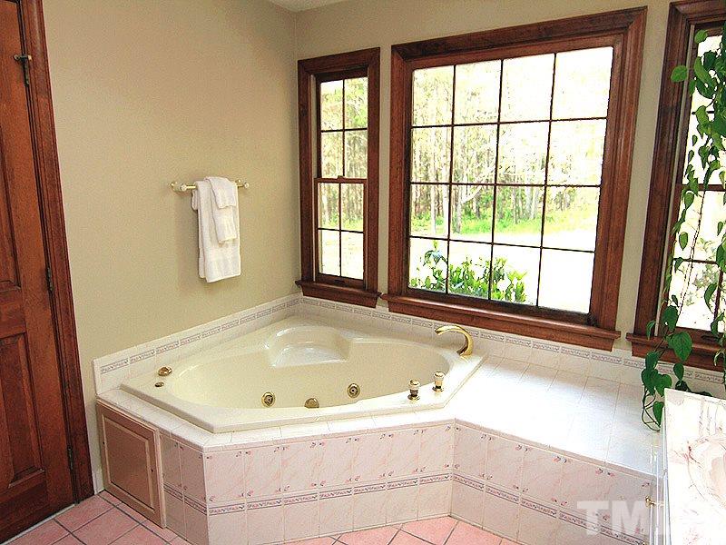4117 Lassiter Road Wake Forest, NC 27587 - Photo 8 of 22 Private master bath has corner garden tub and dual vanities.