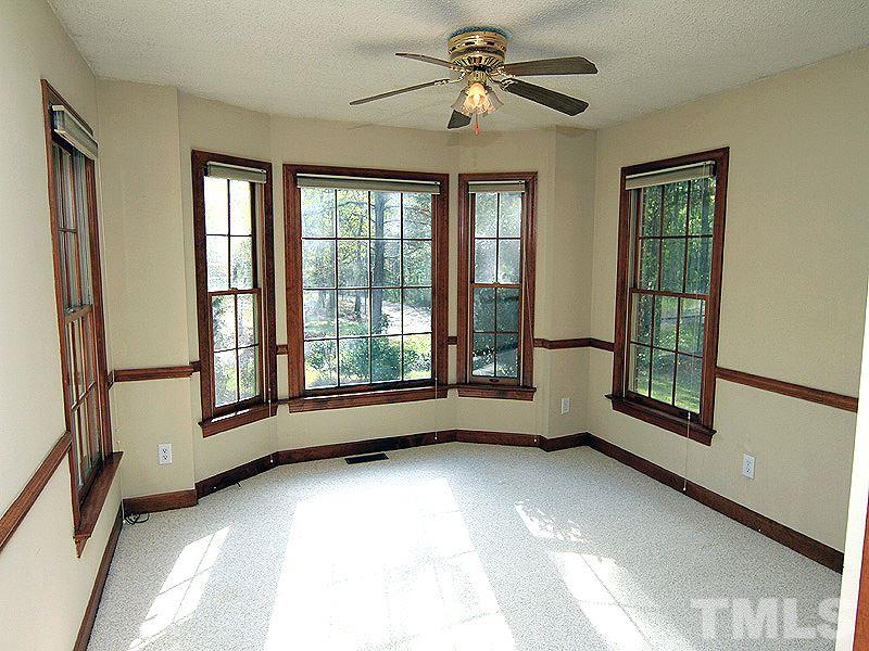 4117 Lassiter Road Wake Forest, NC 27587 - Photo 9 of 22 This spacious bedroom has a beautiful bay window and double door entry.