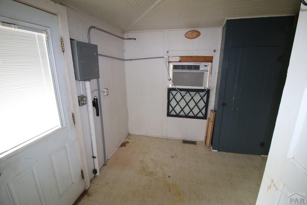 604 South Main Street Fowler, CO 81039 - Photo 15 of 38 a view of an empty room with wooden floor and a window