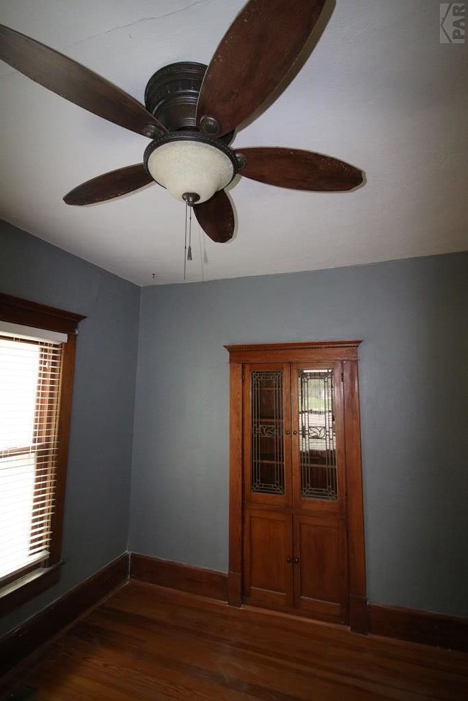 604 South Main Street Fowler, CO 81039 - Photo 23 of 38 a view of an empty room with wooden floor and a window