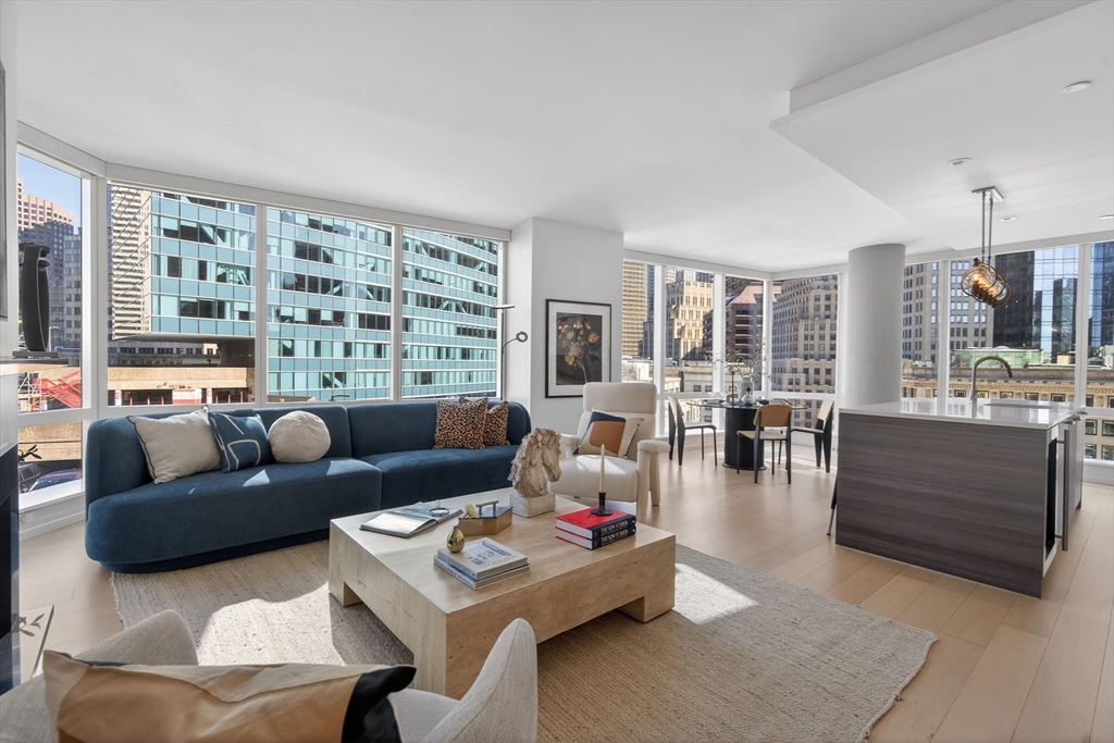 1 Franklin Street, Unit 1408 Boston, MA 02110 - Photo 2 of 37 a living room with furniture and a large window