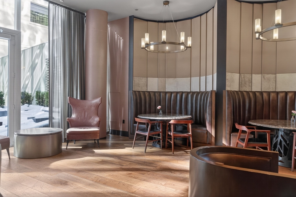 1 Franklin Street, Unit 1408 Boston, MA 02110 - Photo 27 of 37 a view of a lobby with furniture and chandelier