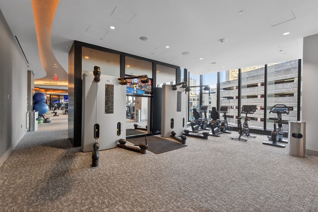 1 Franklin Street, Unit 1408 Boston, MA 02110 - Photo 34 of 37 a view of a room with gym equipment