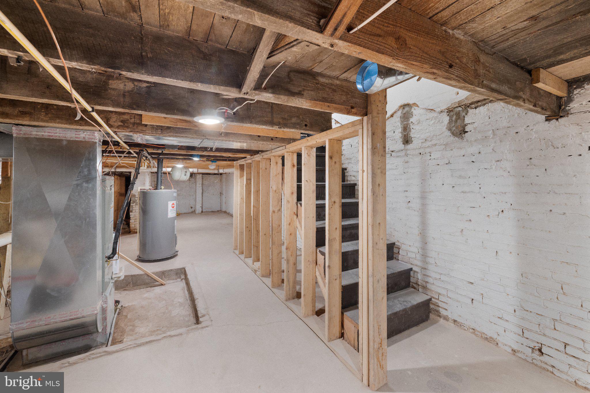 1007 Bennett Place Baltimore, MD 21223 - Photo 22 of 28 LL - Unfinished basement w/ lots of storage space