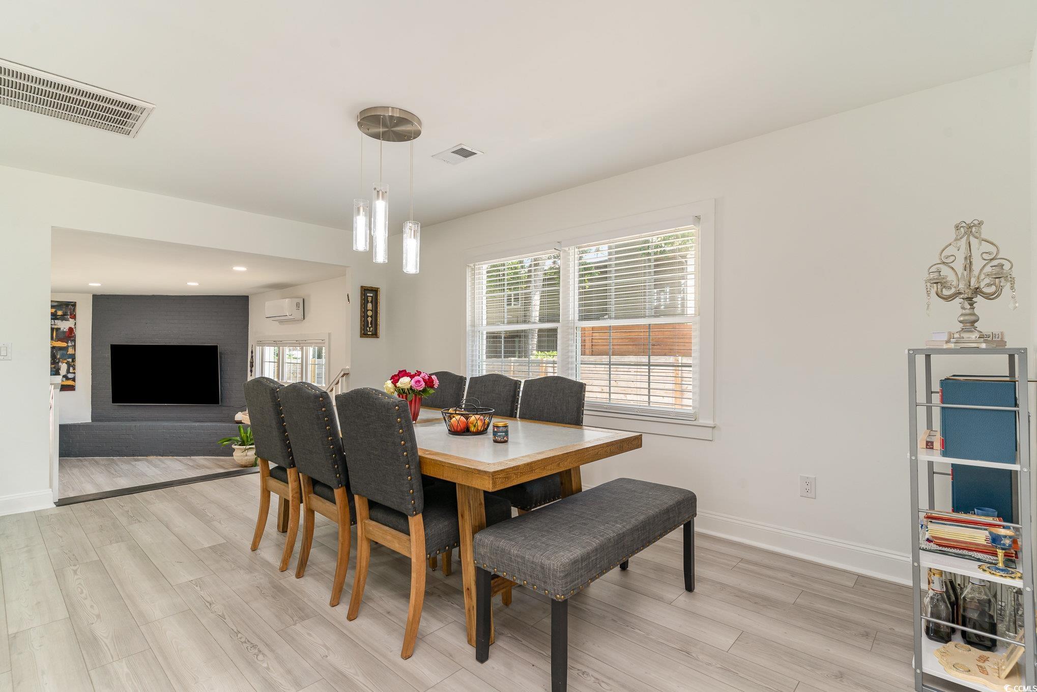 5811 Sumter Drive Myrtle Beach, SC 29577 - Photo 12 of 39 Dining room with light wood-style floors