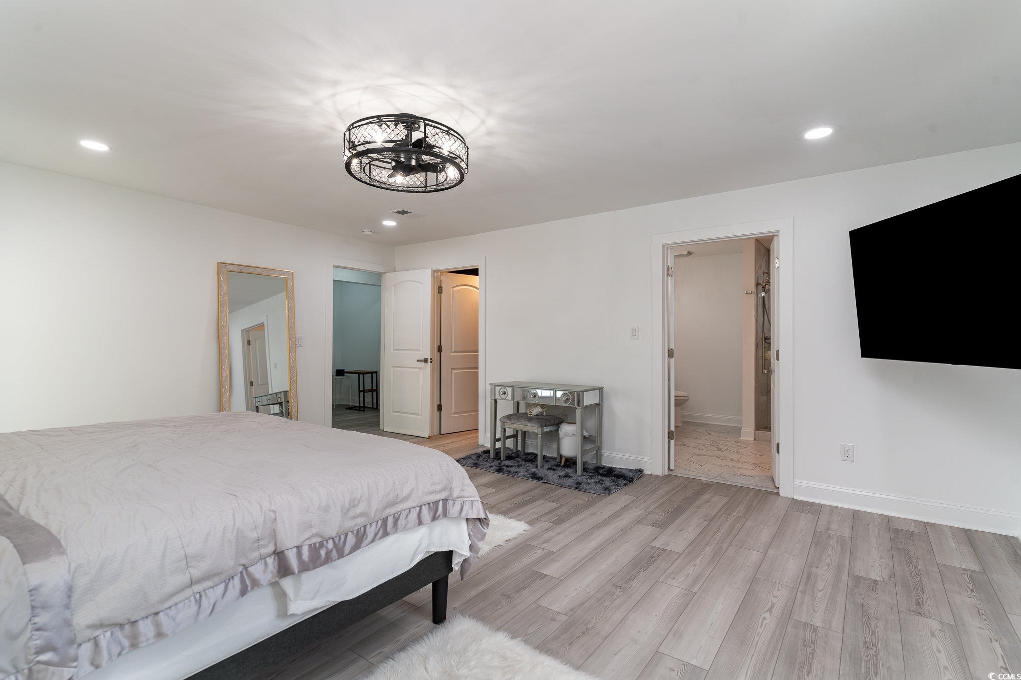 5811 Sumter Drive Myrtle Beach, SC 29577 - Photo 25 of 39 Bedroom with recessed lighting, light wood-style floors, and ensuite bathroom