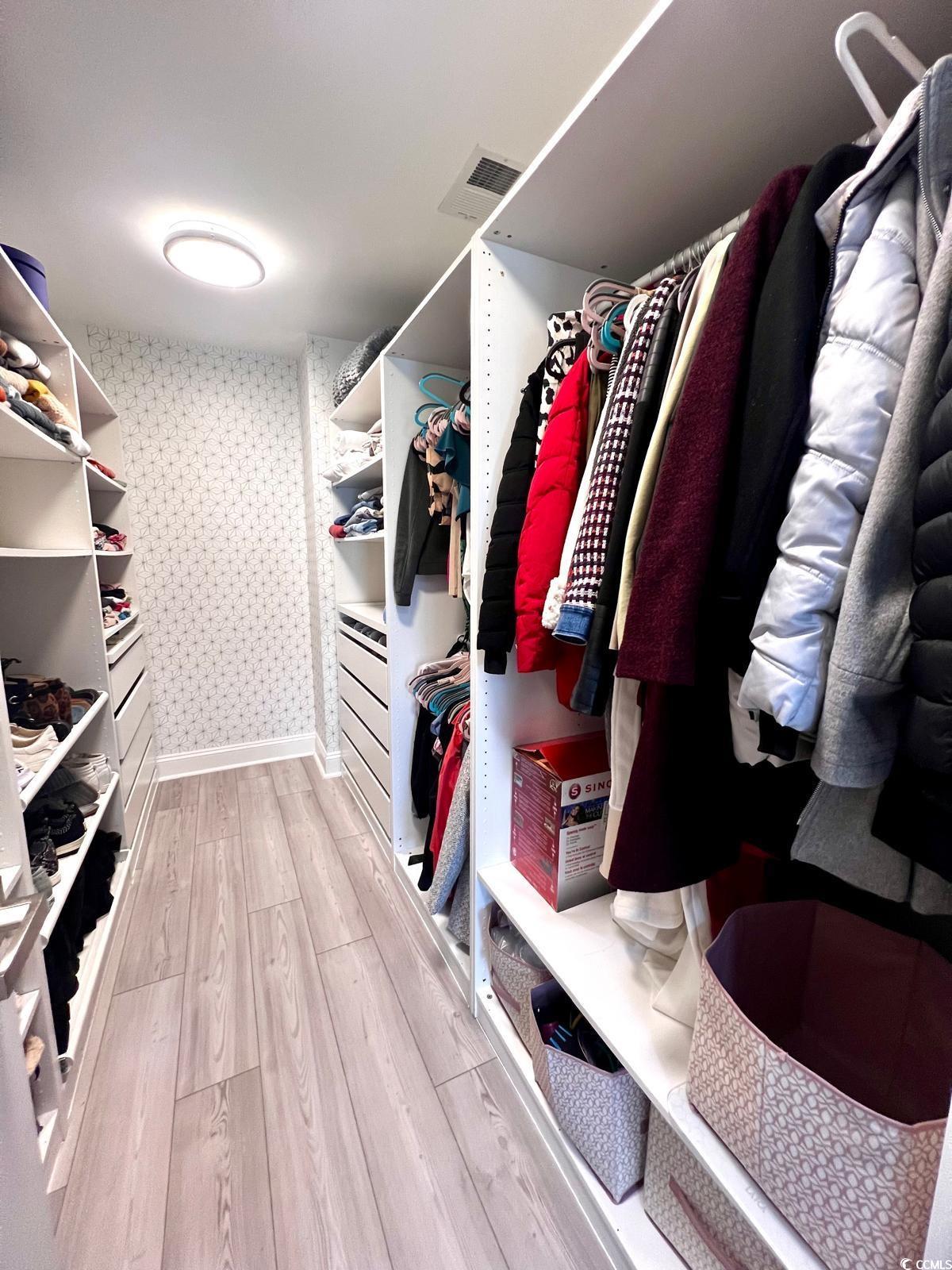 5811 Sumter Drive Myrtle Beach, SC 29577 - Photo 30 of 39 Walk in closet featuring light wood finished floors