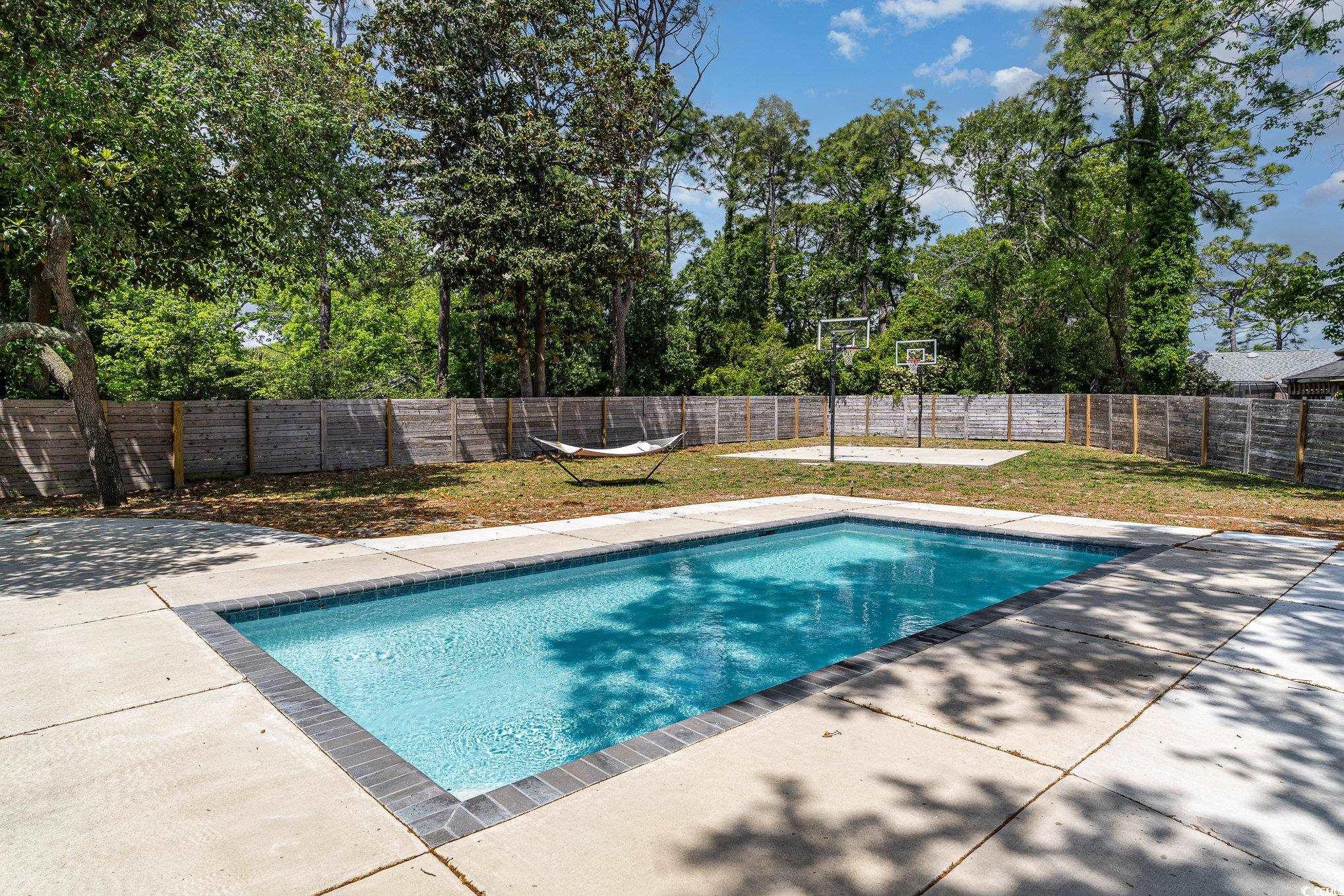 5811 Sumter Drive Myrtle Beach, SC 29577 - Photo 34 of 39 View of pool featuring a patio area and a fenced backyard