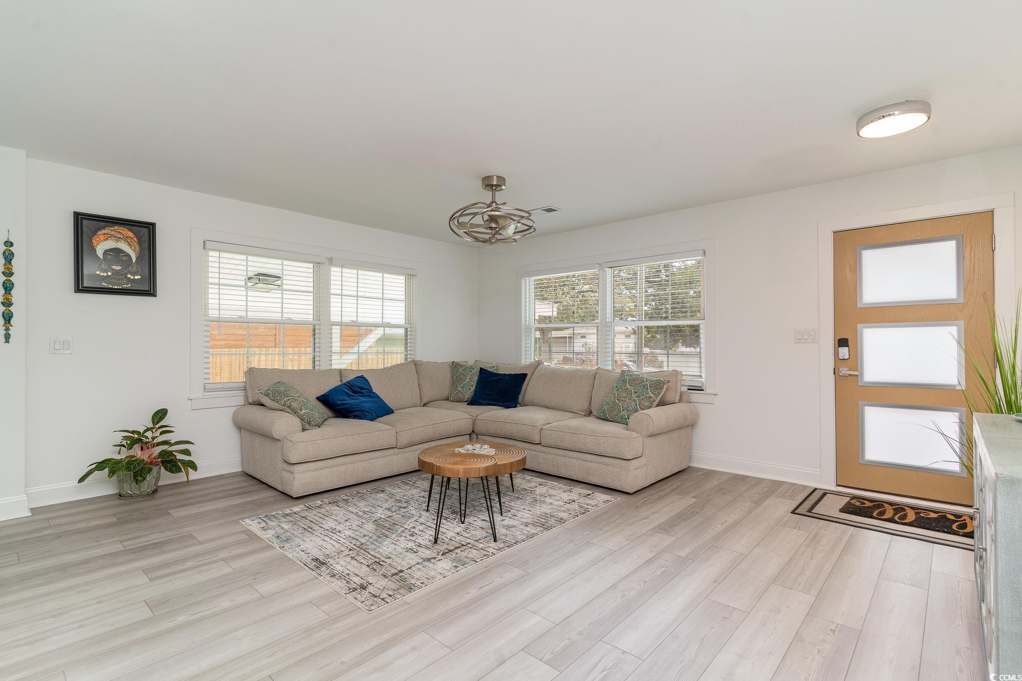 5811 Sumter Drive Myrtle Beach, SC 29577 - Photo 5 of 39 Living room featuring light wood-type flooring and baseboards