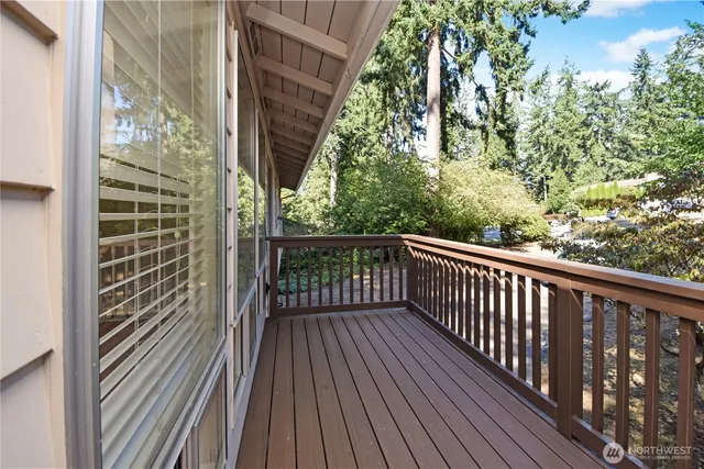 a view of a balcony with wooden floor