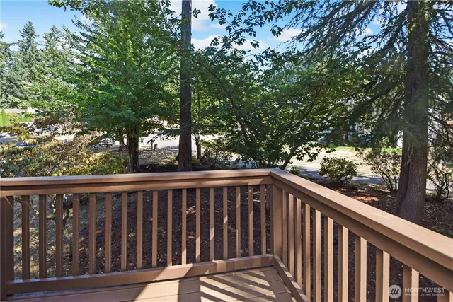 a view of balcony with wooden floor