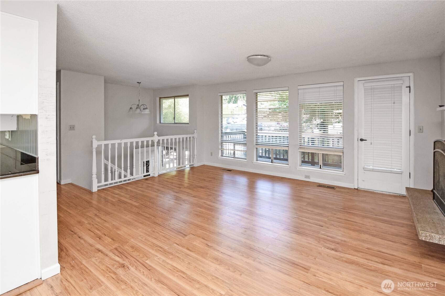 308 Point Fosdick Place Northwest Gig Harbor, WA 98335 - Photo 18 of 35 wooden floor in an empty room with a window