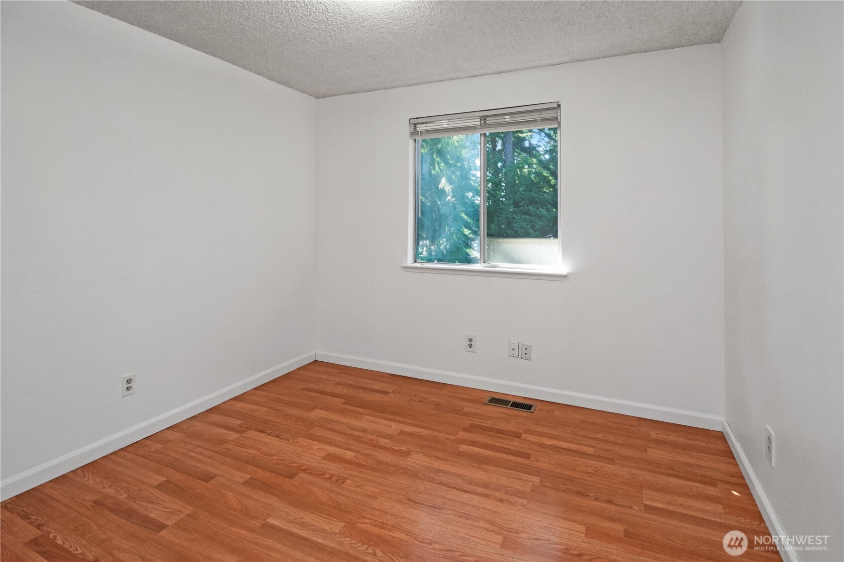 308 Point Fosdick Place Northwest Gig Harbor, WA 98335 - Photo 20 of 35 an empty room with a window