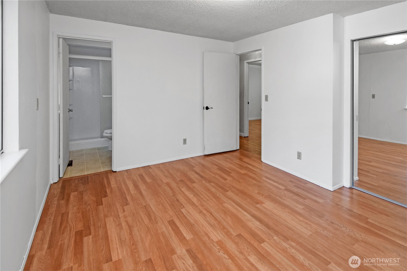 308 Point Fosdick Place Northwest Gig Harbor, WA 98335 - Photo 25 of 35 a view of empty room with wooden floor