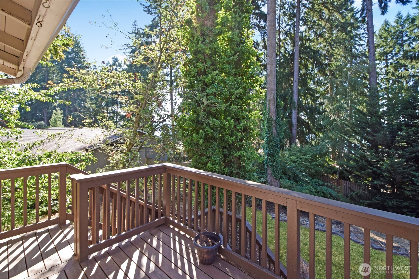 308 Point Fosdick Place Northwest Gig Harbor, WA 98335 - Photo 6 of 35 a view of balcony with wooden floor and fence