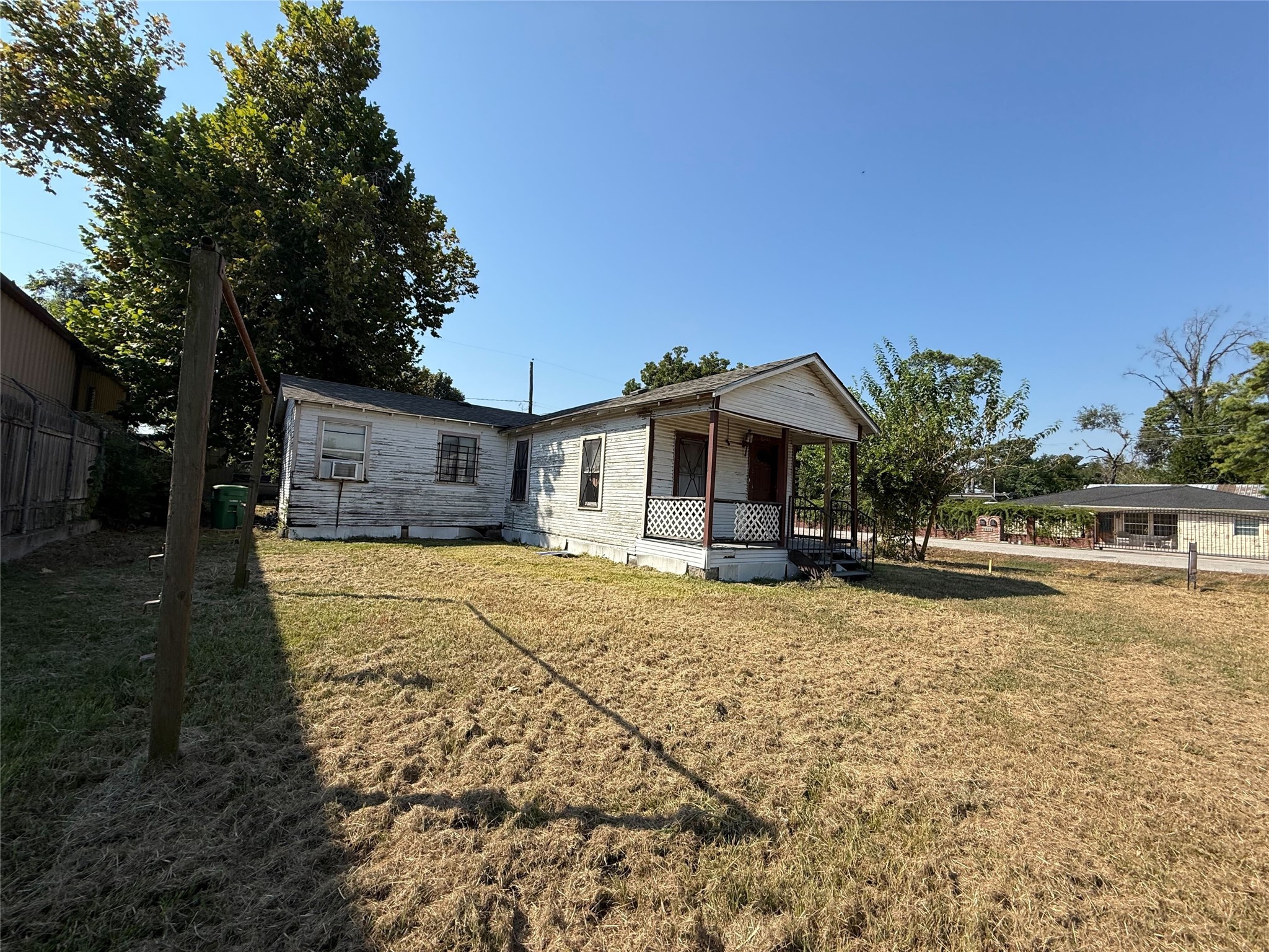 6221 Peg Street Houston, TX 77092 - Photo 2 of 14 a front view of a house with a yard and garage