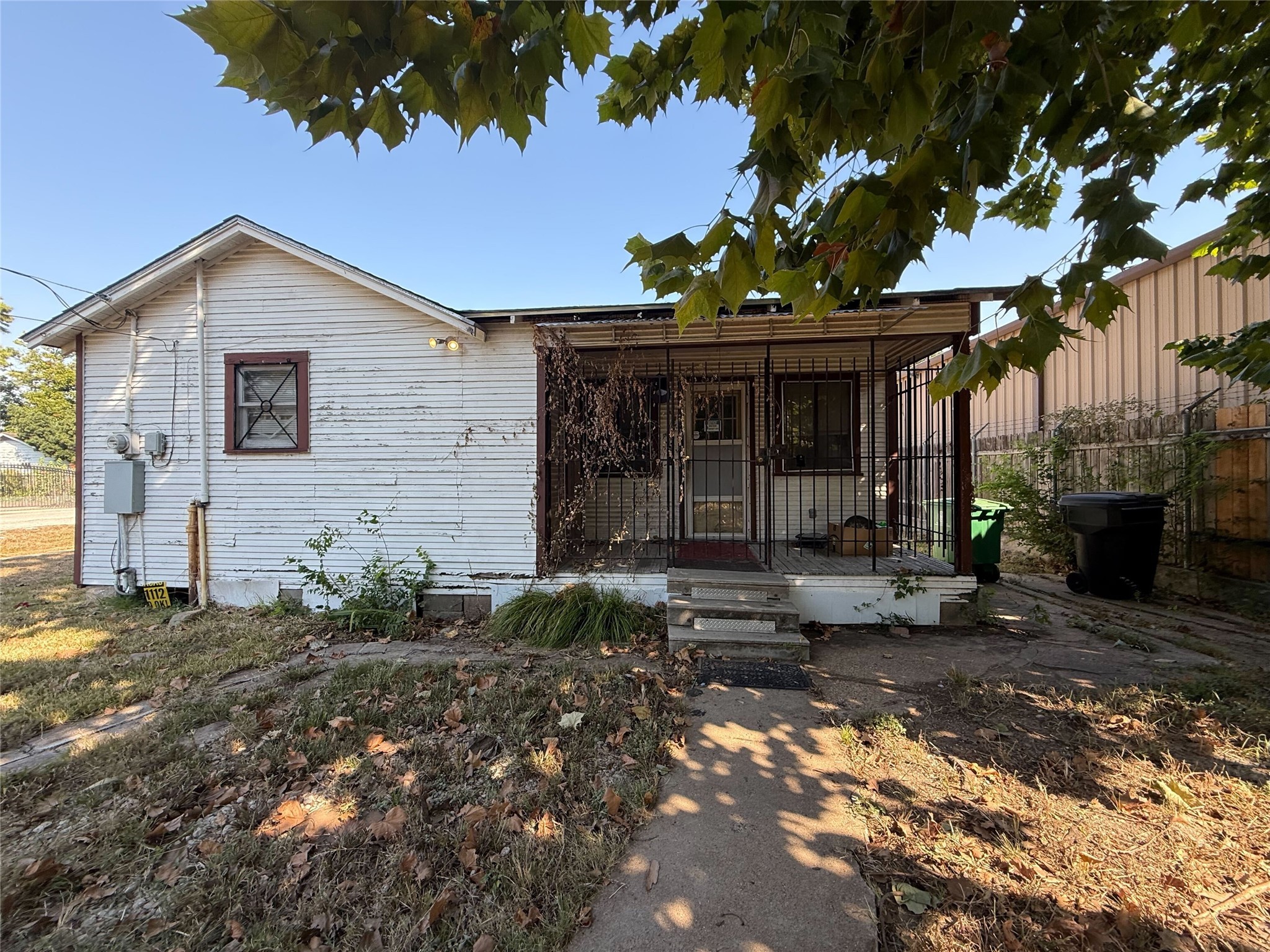 6221 Peg Street Houston, TX 77092 - Photo 10 of 14 a view of a house with a small yard and sitting area