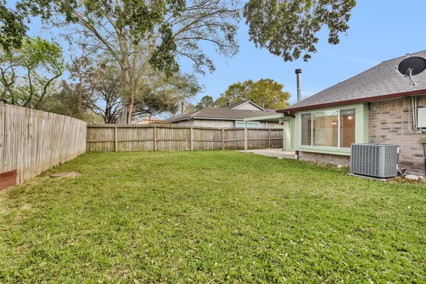 a house that has a tree in front of it