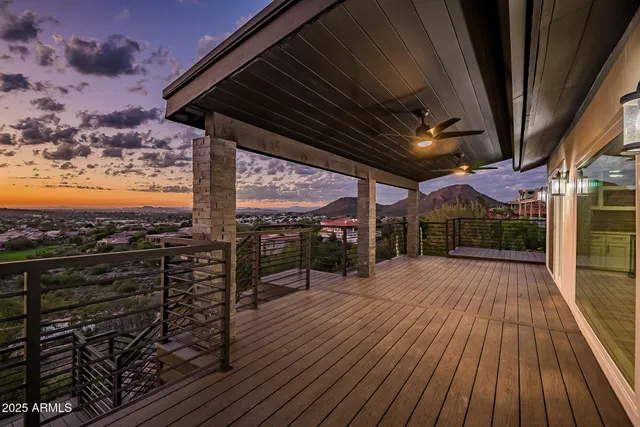 a view of a balcony with wooden floor