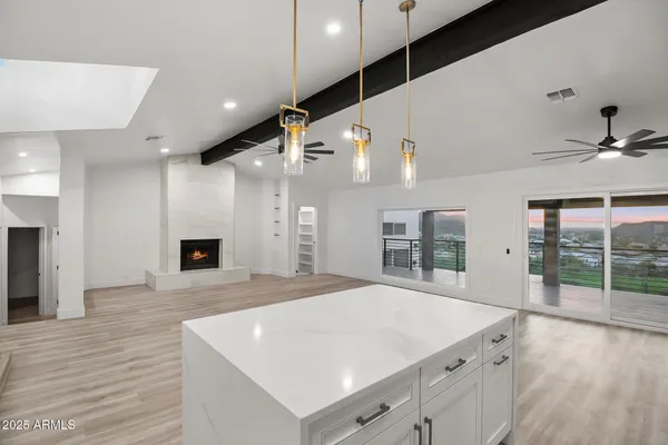 a kitchen with a sink a stove a refrigerator and cabinets