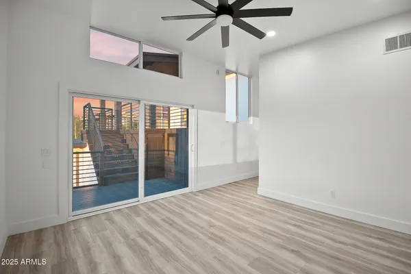 a view of balcony with wooden floor
