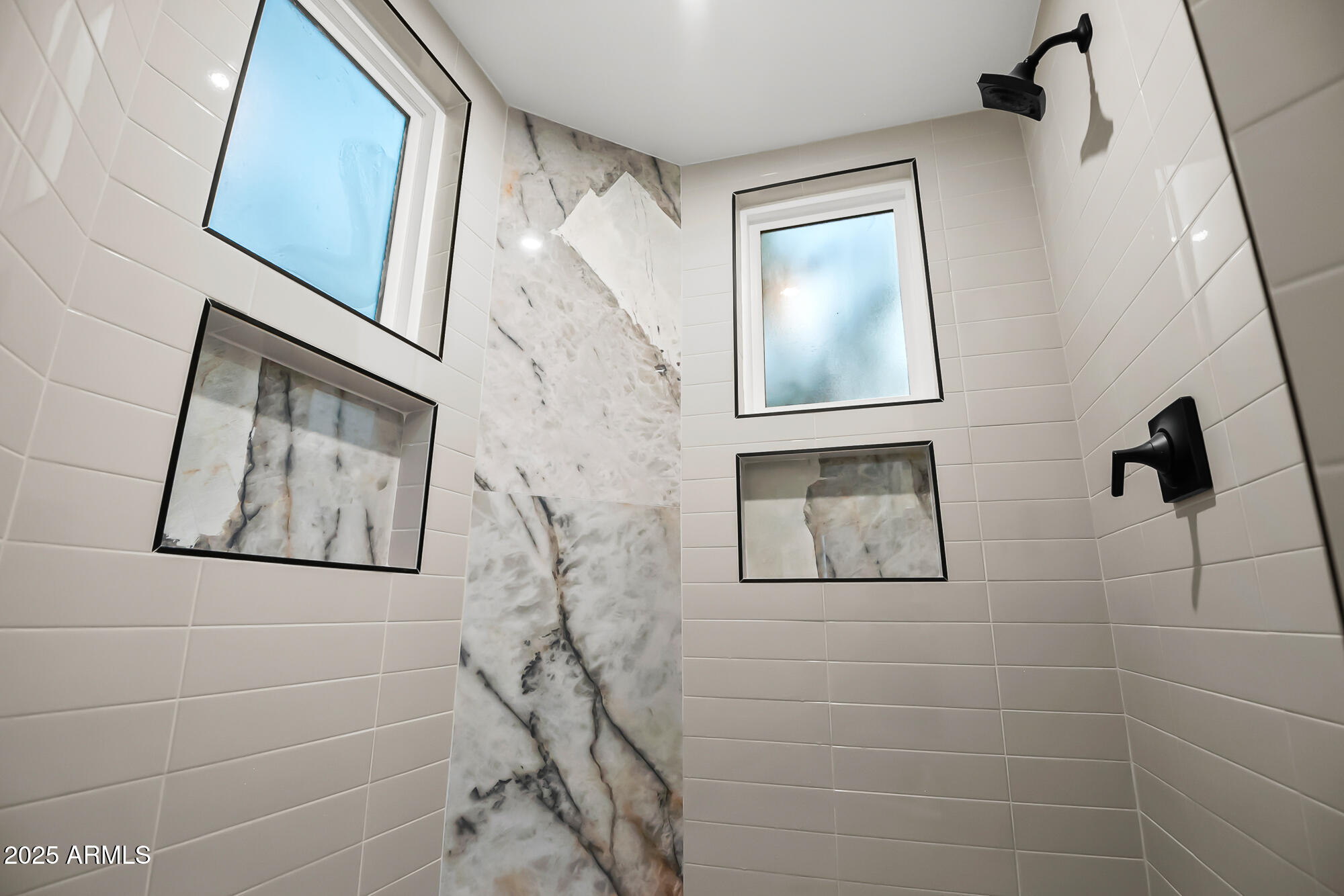 13428 North 16th Place Phoenix, AZ 85022 - Photo 15 of 29 a bathroom with a shower and a window