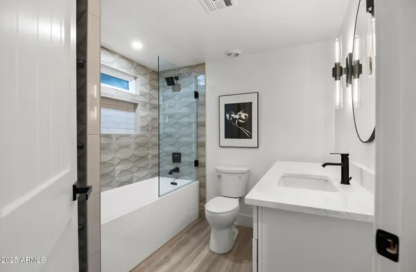 a bathroom with a shower and a window