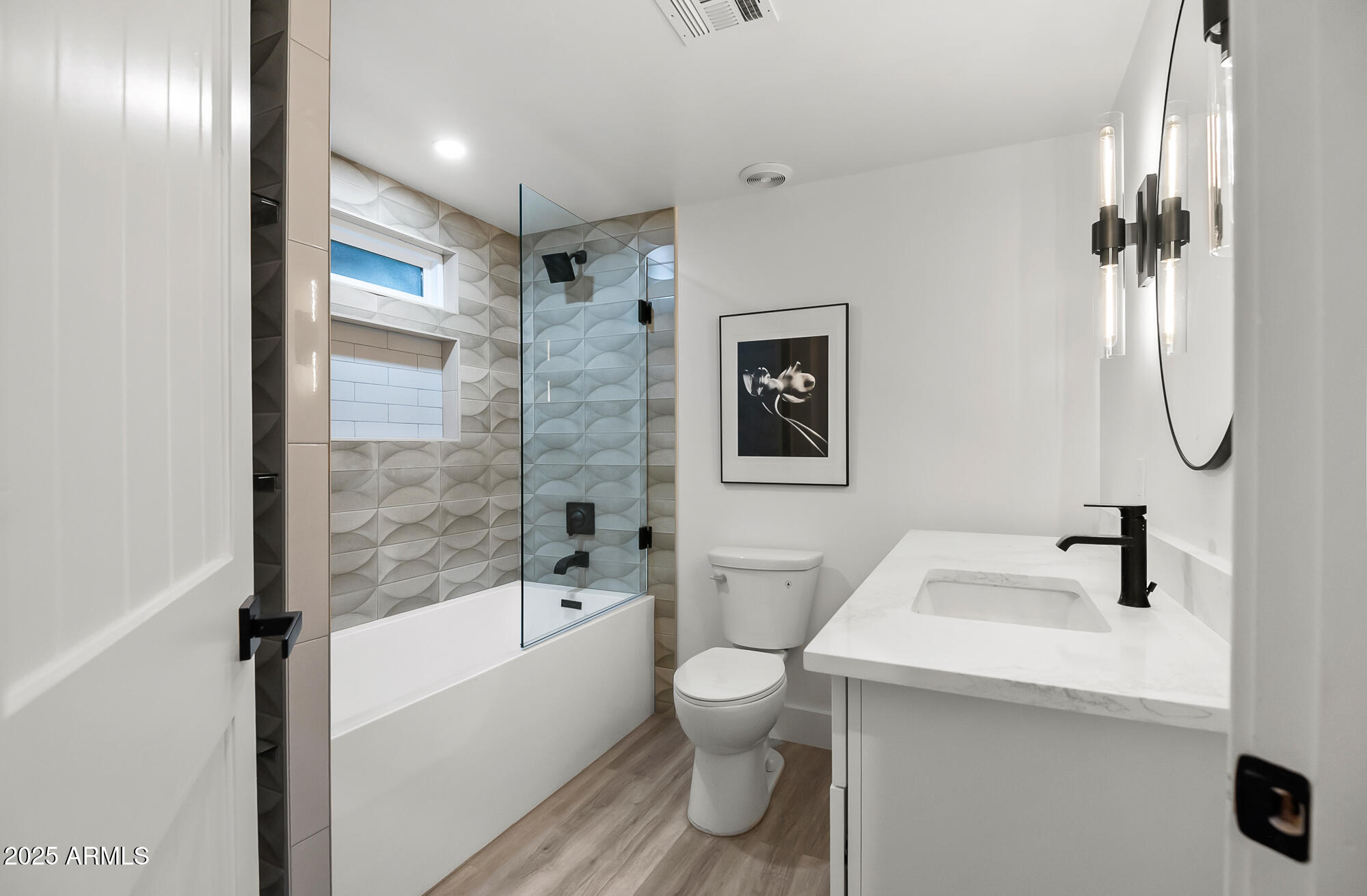 13428 North 16th Place Phoenix, AZ 85022 - Photo 16 of 29 a bathroom with a sink toilet and shower