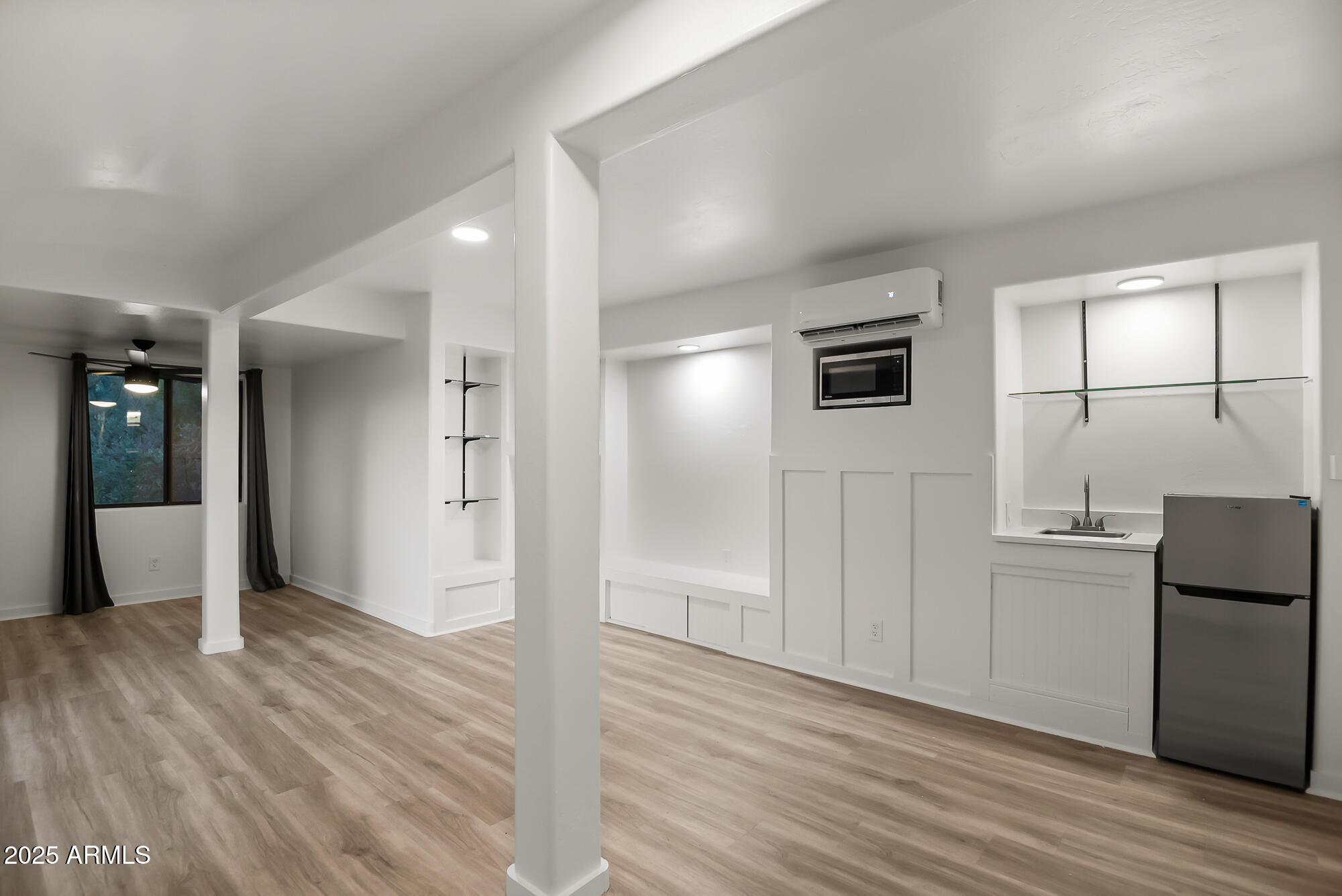13428 North 16th Place Phoenix, AZ 85022 - Photo 17 of 29 a view of a kitchen cabinets and wooden floor