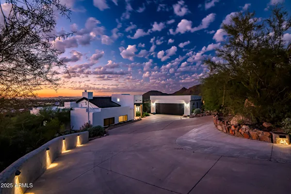 a view of a house with a yard and garage