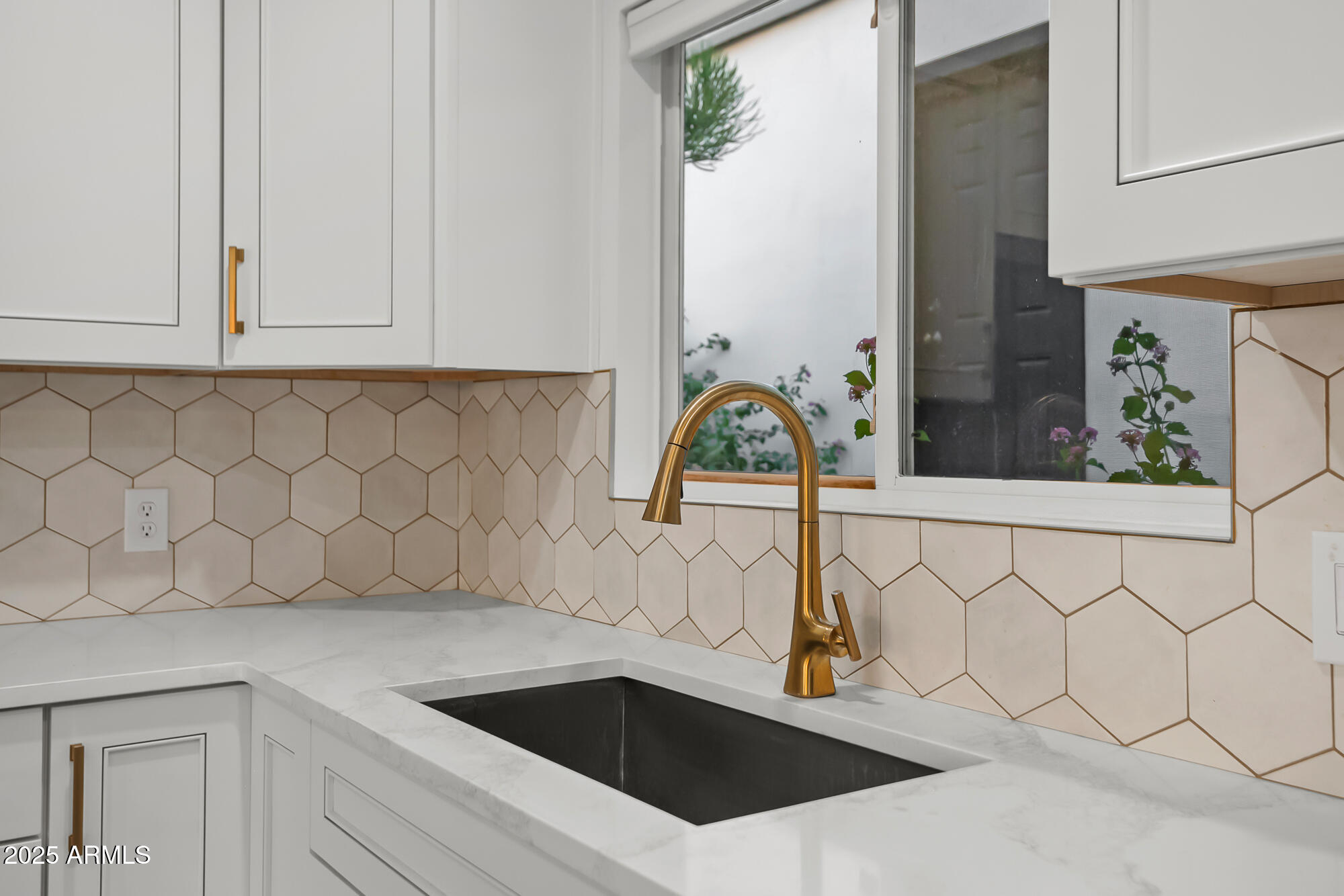 13428 North 16th Place Phoenix, AZ 85022 - Photo 6 of 29 a sink with a white cabinet and a granite counter top