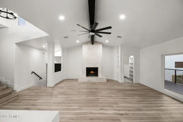 a sink with a white cabinet and a granite counter top