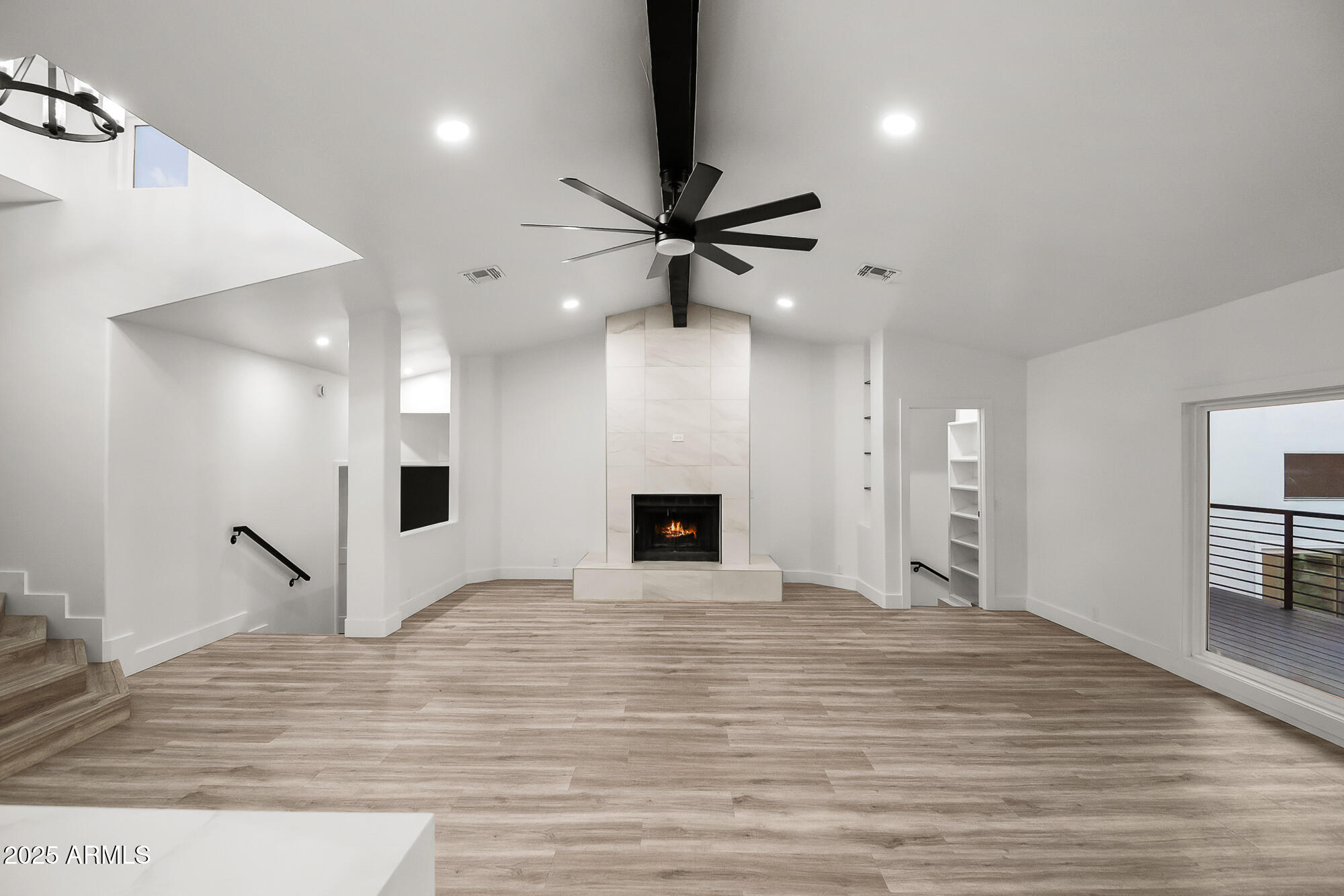 13428 North 16th Place Phoenix, AZ 85022 - Photo 8 of 29 a view of an empty room with a fireplace and a window