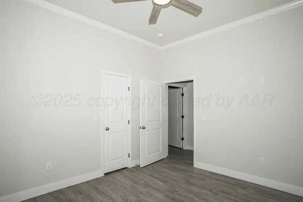 an empty room with wooden floor