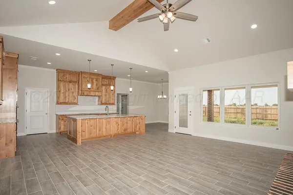 a large space with a large tub and shower