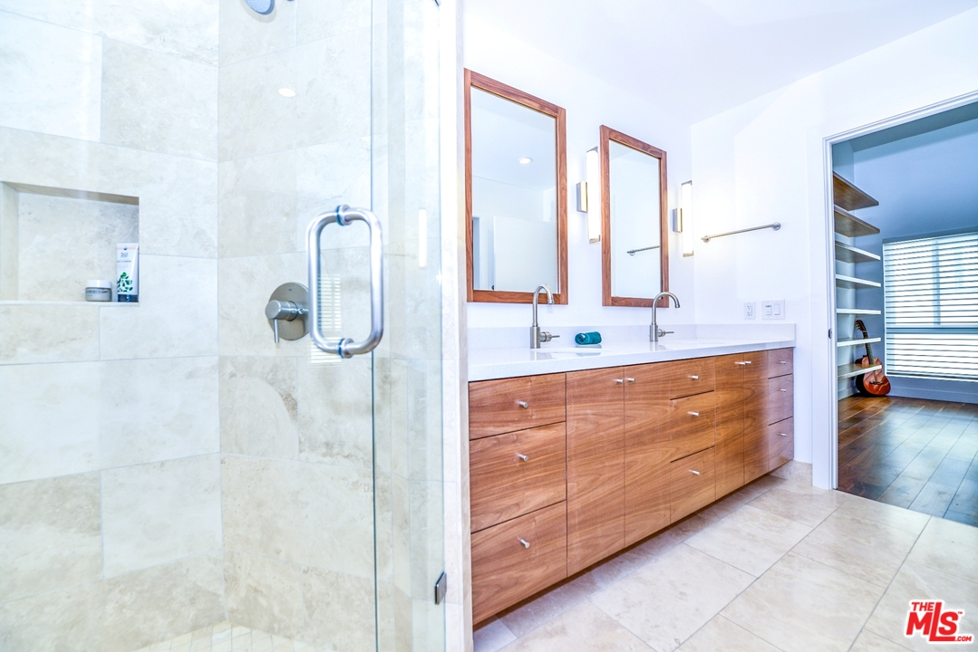 914 2nd Street, Unit B Santa Monica, CA 90403 - Photo 12 of 29 a bathroom with a double vanity sink mirror and shower