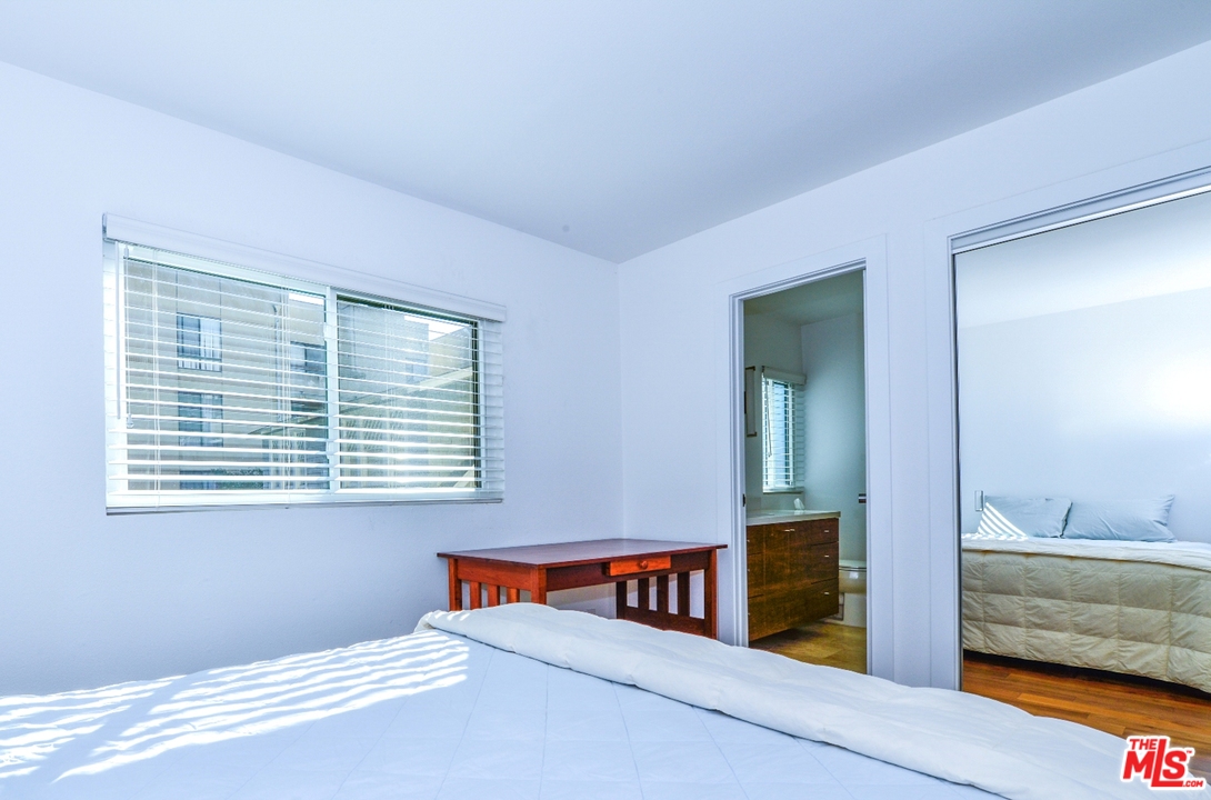 914 2nd Street, Unit B Santa Monica, CA 90403 - Photo 14 of 29 a bedroom with furniture and a window