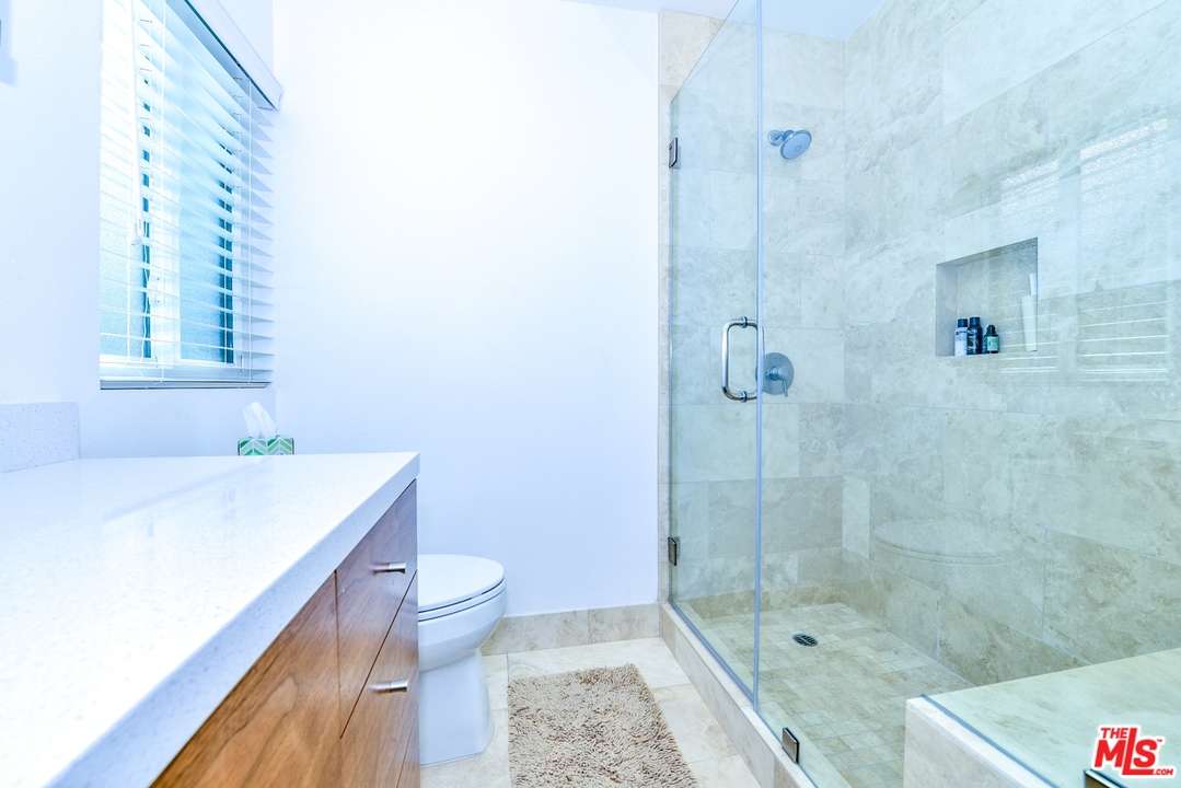 914 2nd Street, Unit B Santa Monica, CA 90403 - Photo 16 of 29 a bathroom with a sink a toilet and shower
